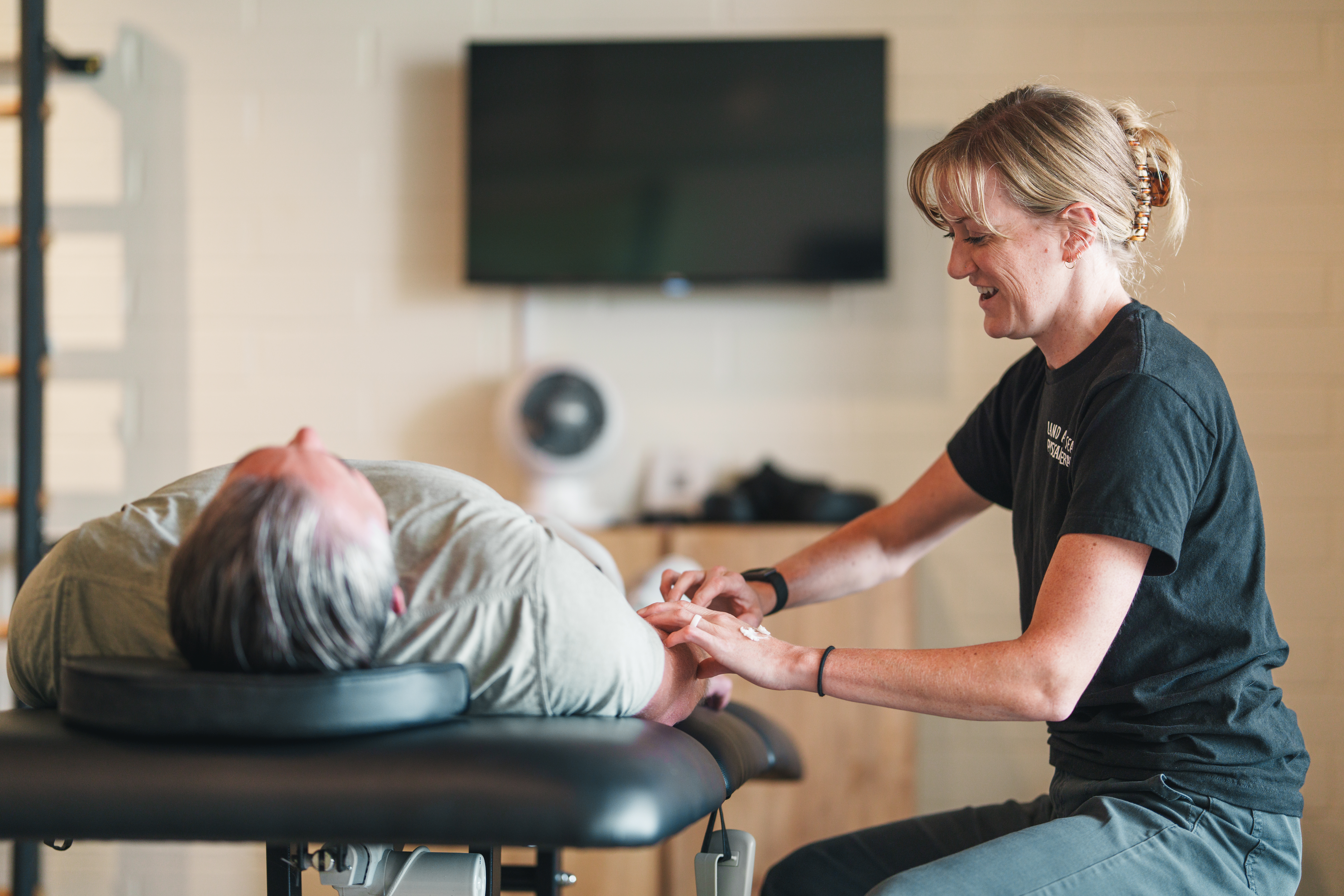 physical therapist treating elbow pain Oceanside CA