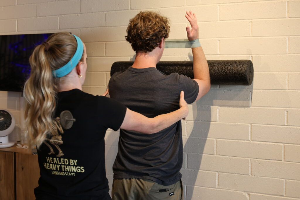 physical therapist helping with posture