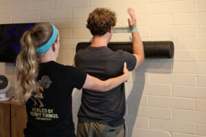 physical therapist helping with posture