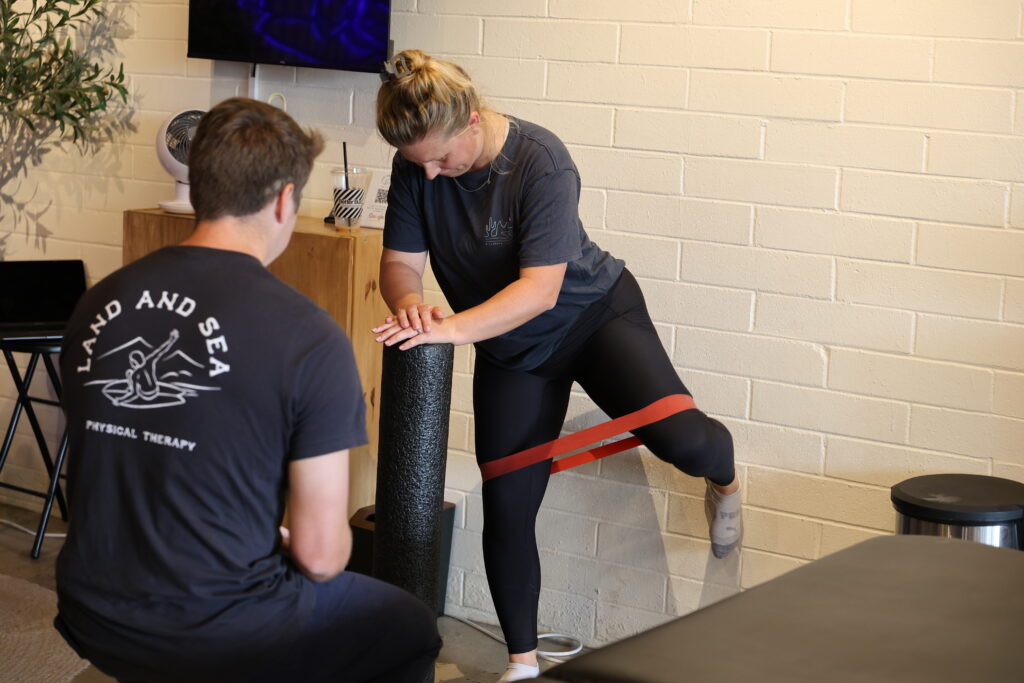 physical therapist and client working on hip