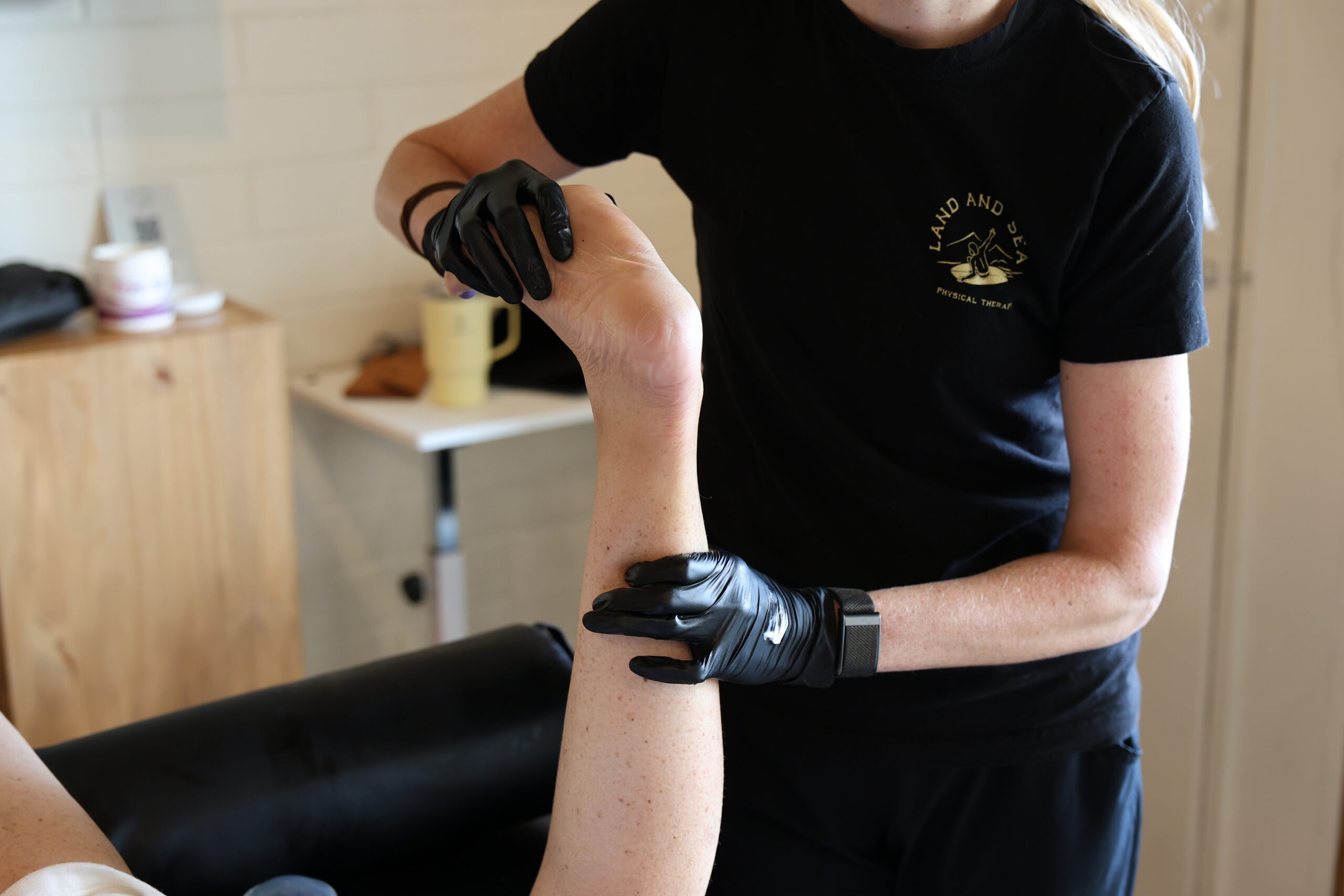 physical therapist working on a foot
