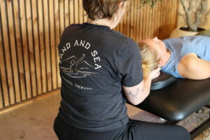 physical therapist working with client