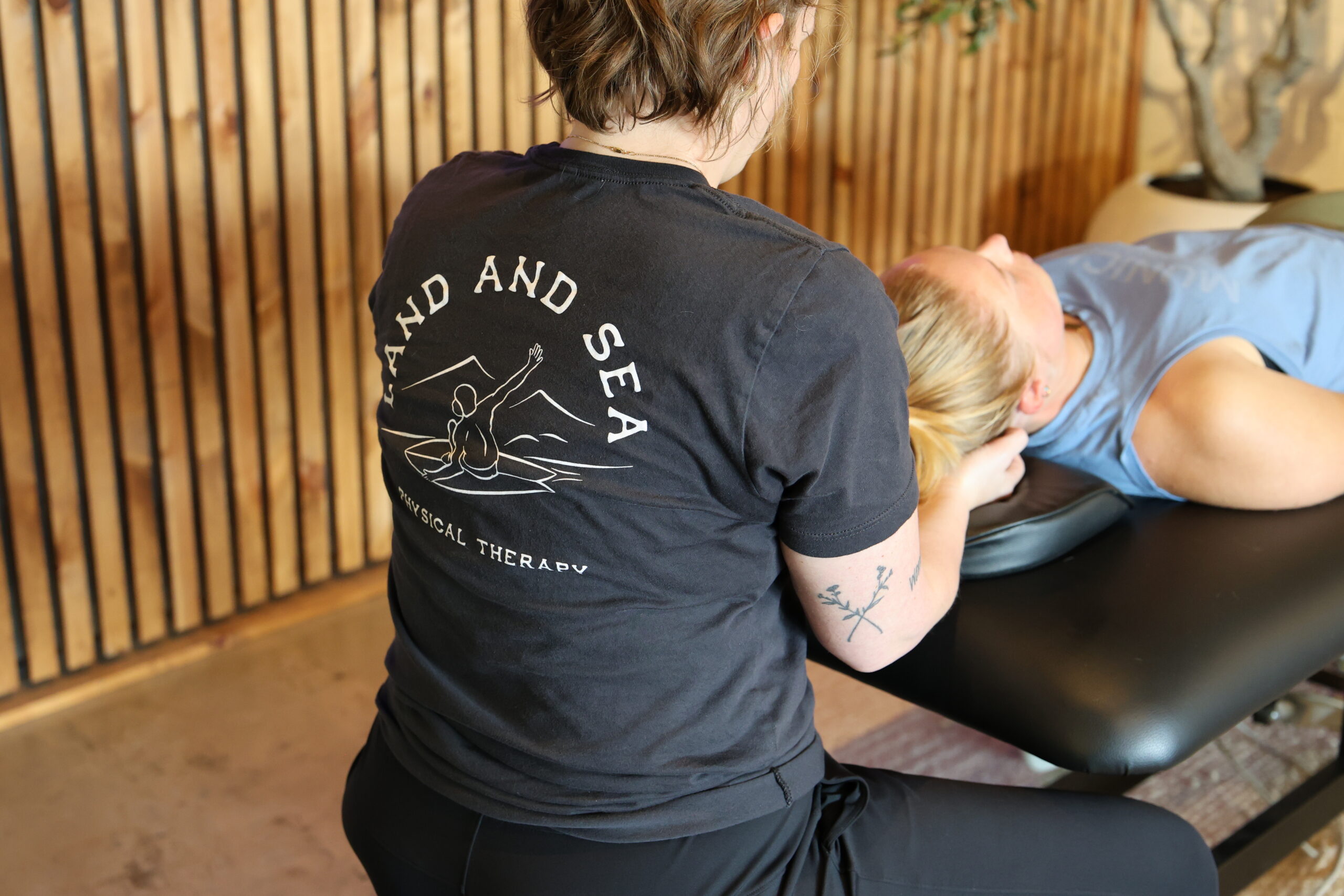 physical therapist working with client