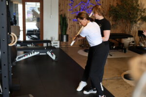 physical therapist working with client on back