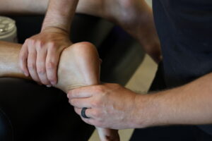 physical therapist working on foot