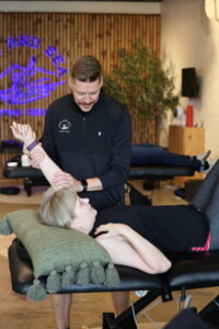 physical therapist working on arm