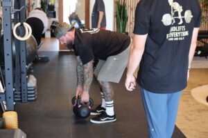 pt client exercising back